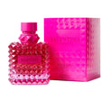 Valentino perfume bottle and packaging with pink design on a white background