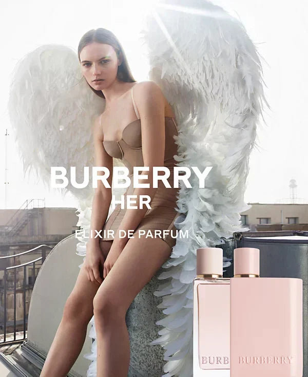 Advertisement for Burberry Her perfume with a woman in a bathtub and product packaging.
